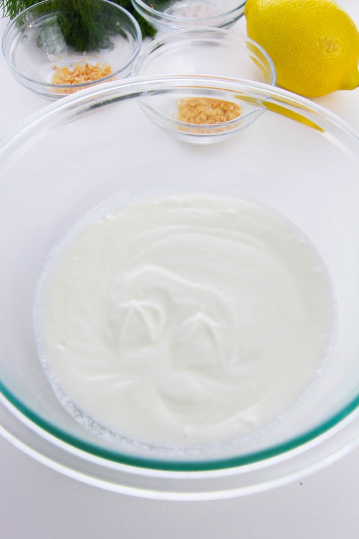 plain Greek yogurt beaten smooth in a glass bowl for veggie dip