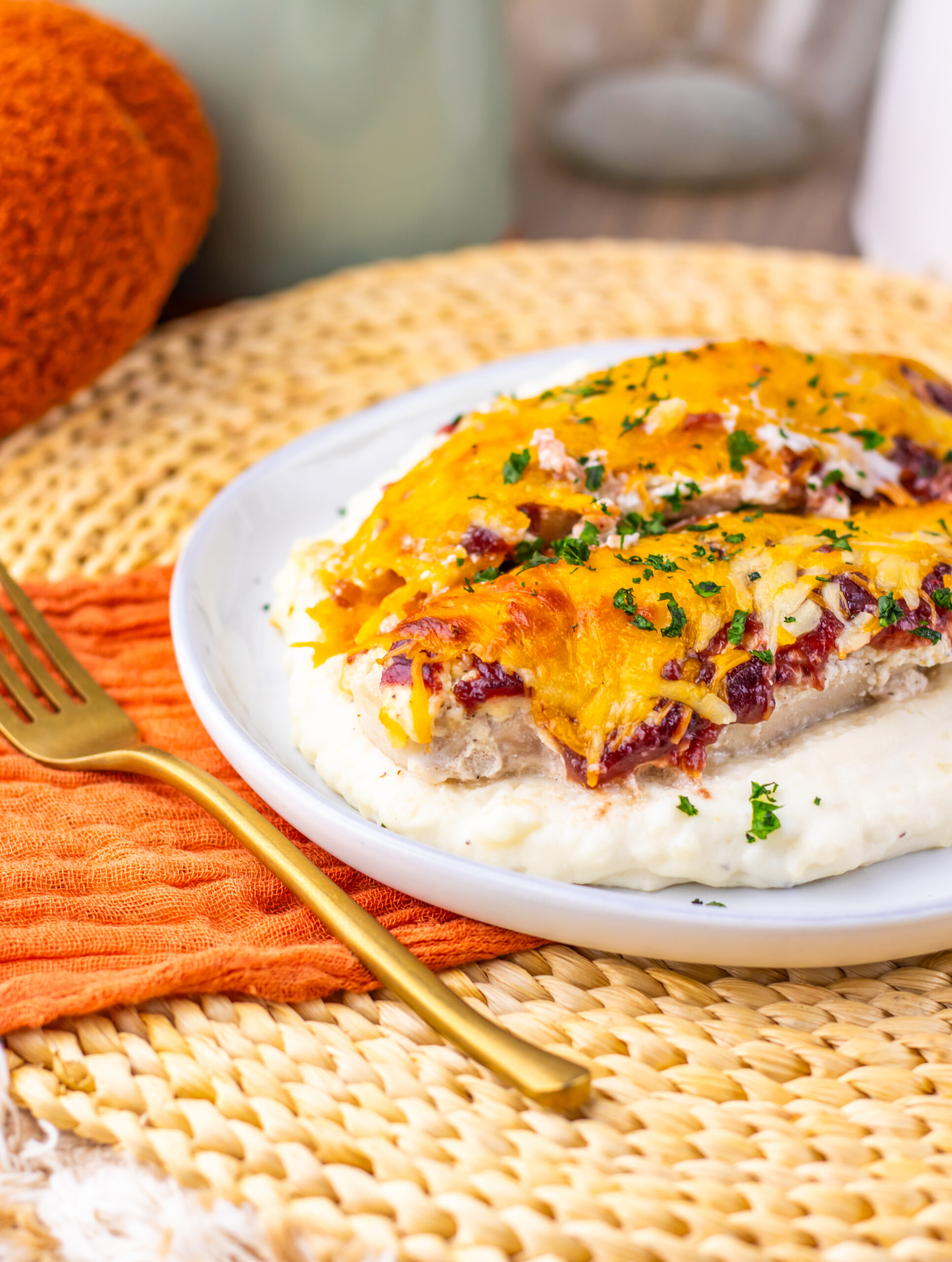 Cranberry cream cheese chicken bake served over mashed potatoes.