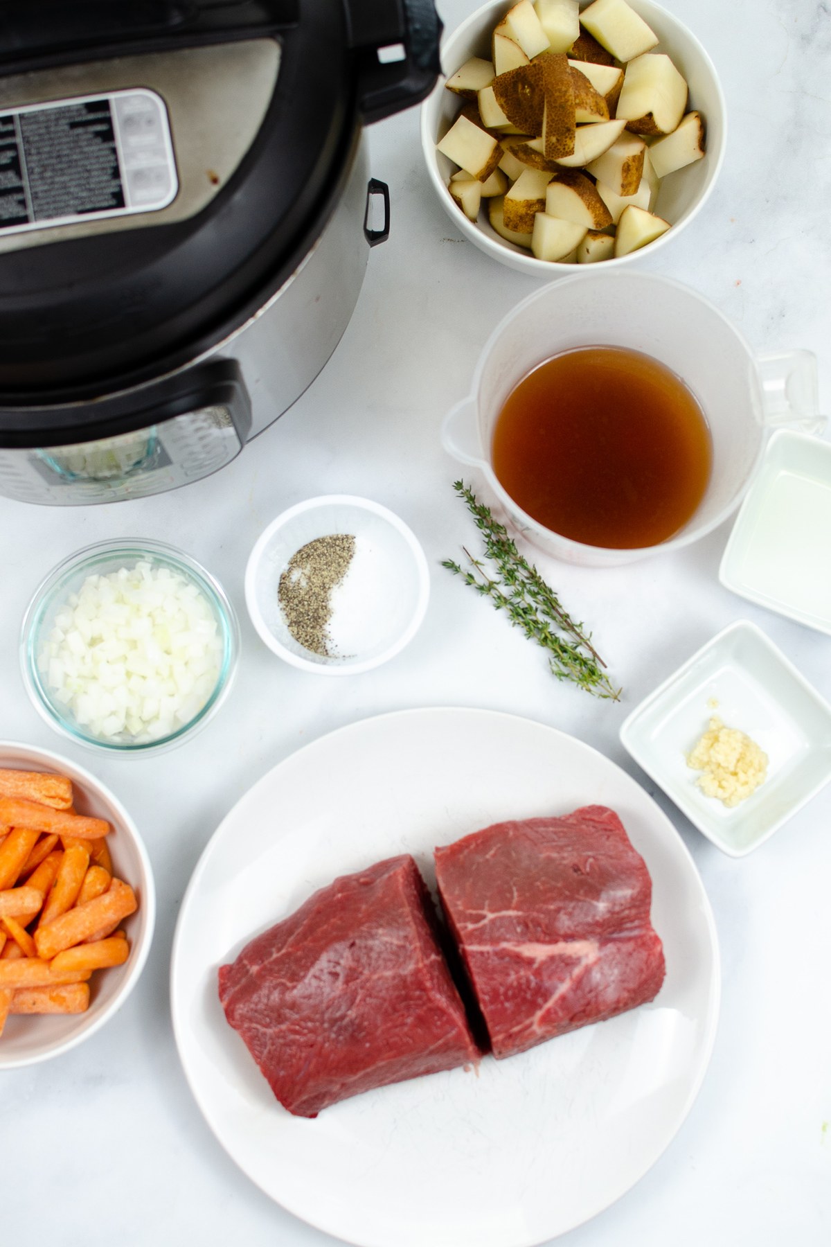 Ingredients for Instant Pot pot roast with carrots and potatoes.