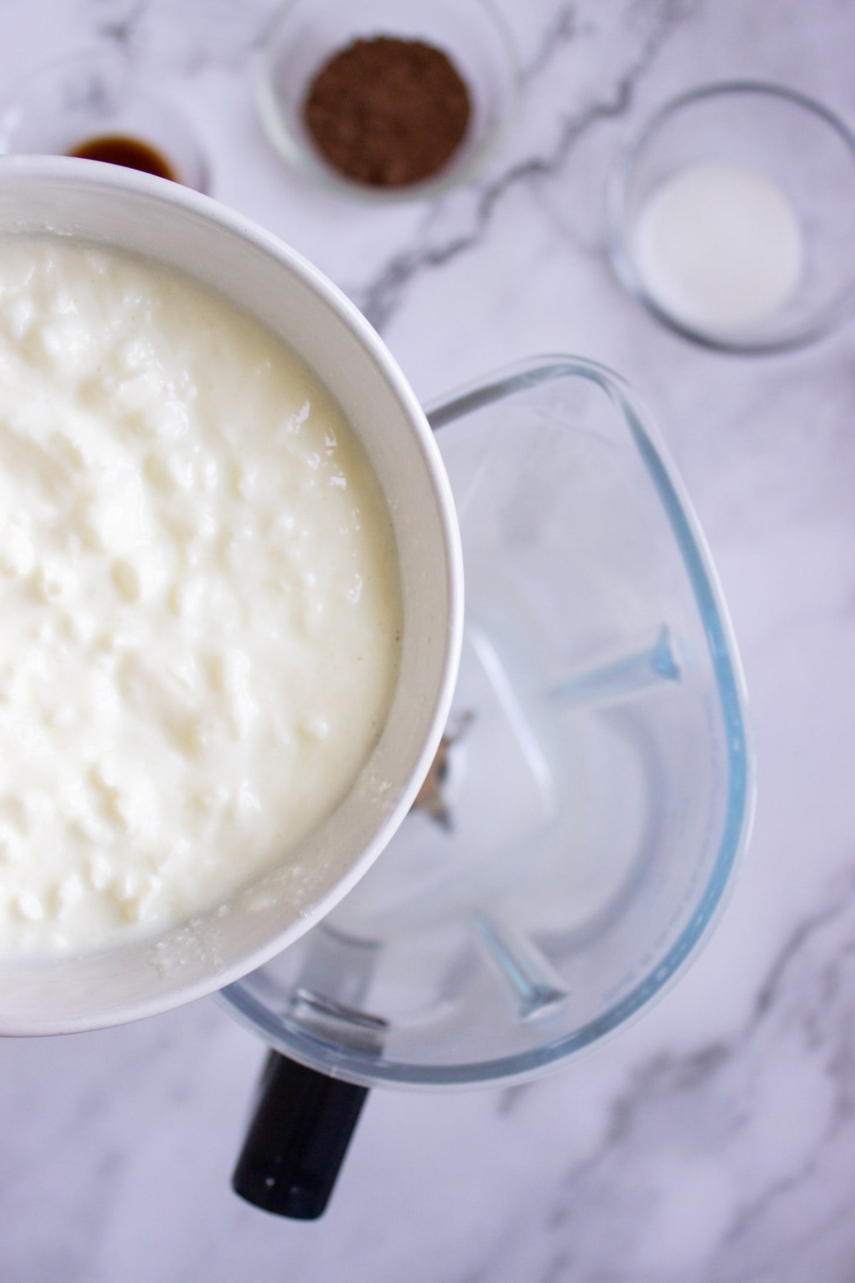 Cottage cheese going into the blender.