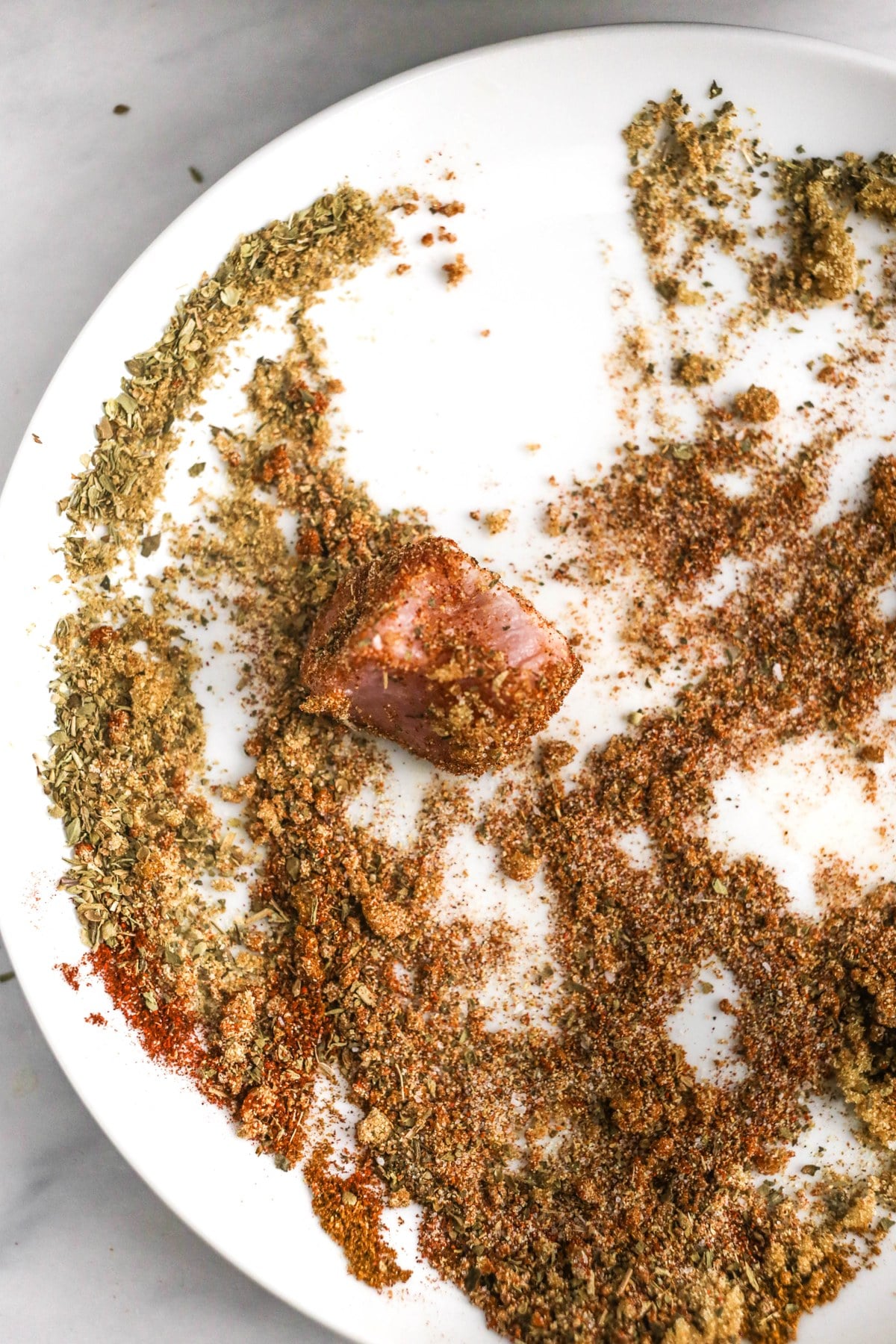 Rub the spice mix all over the pork.