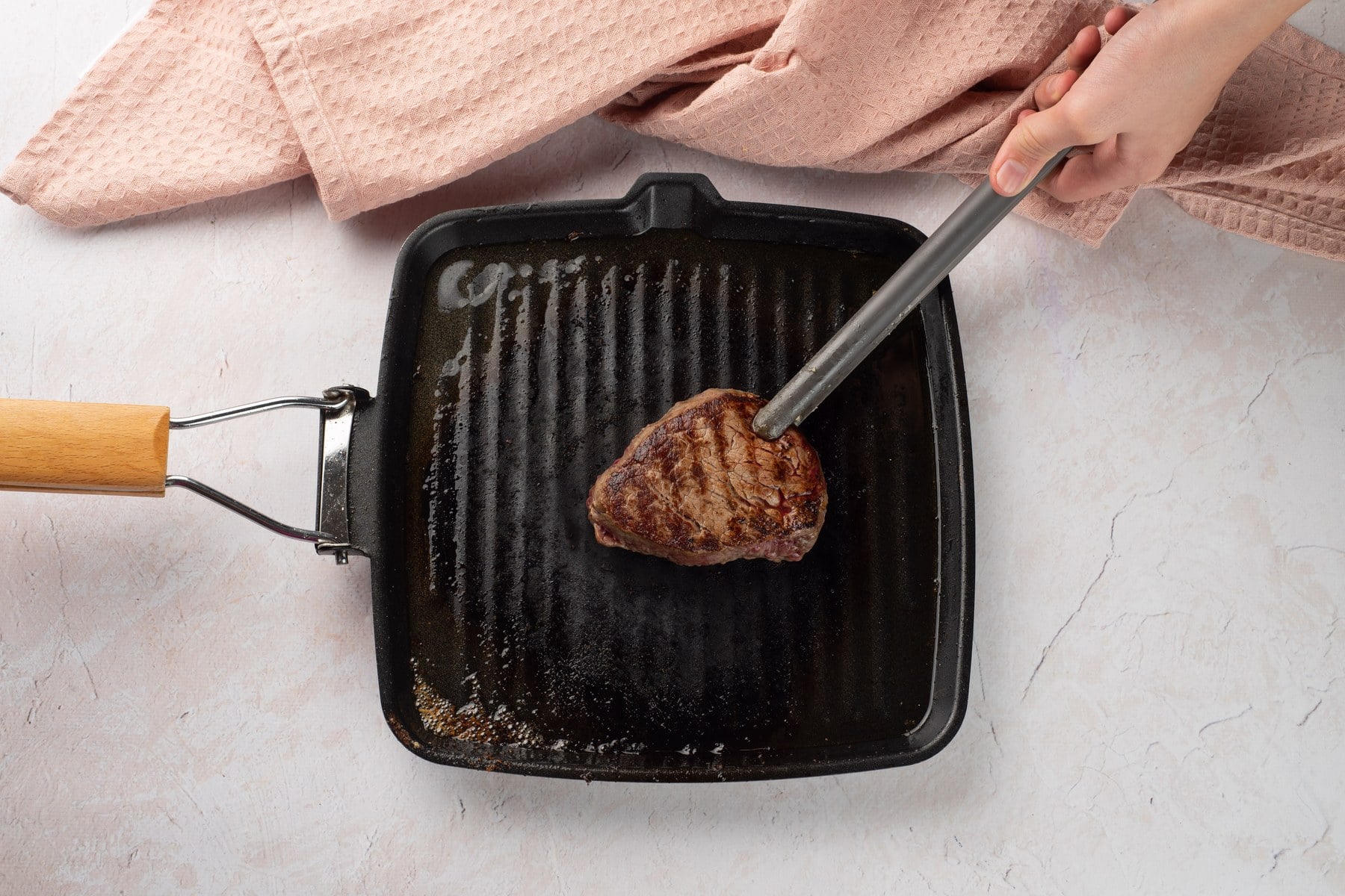 Steak searing in a skillet.