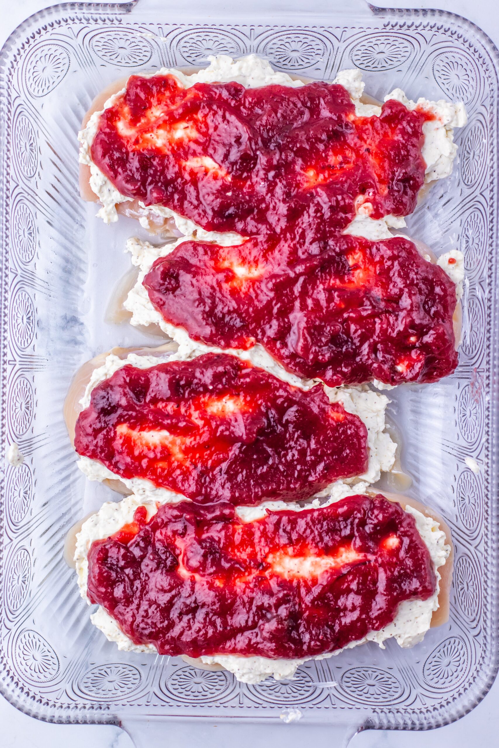 Stir together the cranberry sauce, brown sugar, Dijon, and Worcestershire, and spoon it over the cream cheese layer.