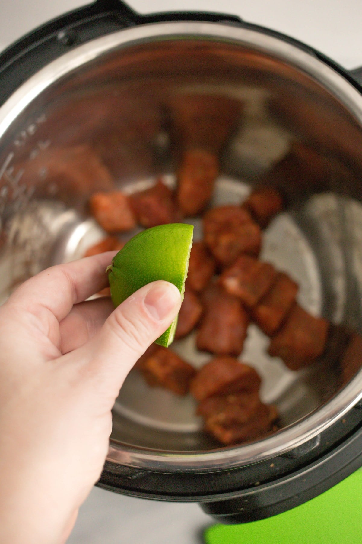 Squeeze fresh lime juice over the pork.