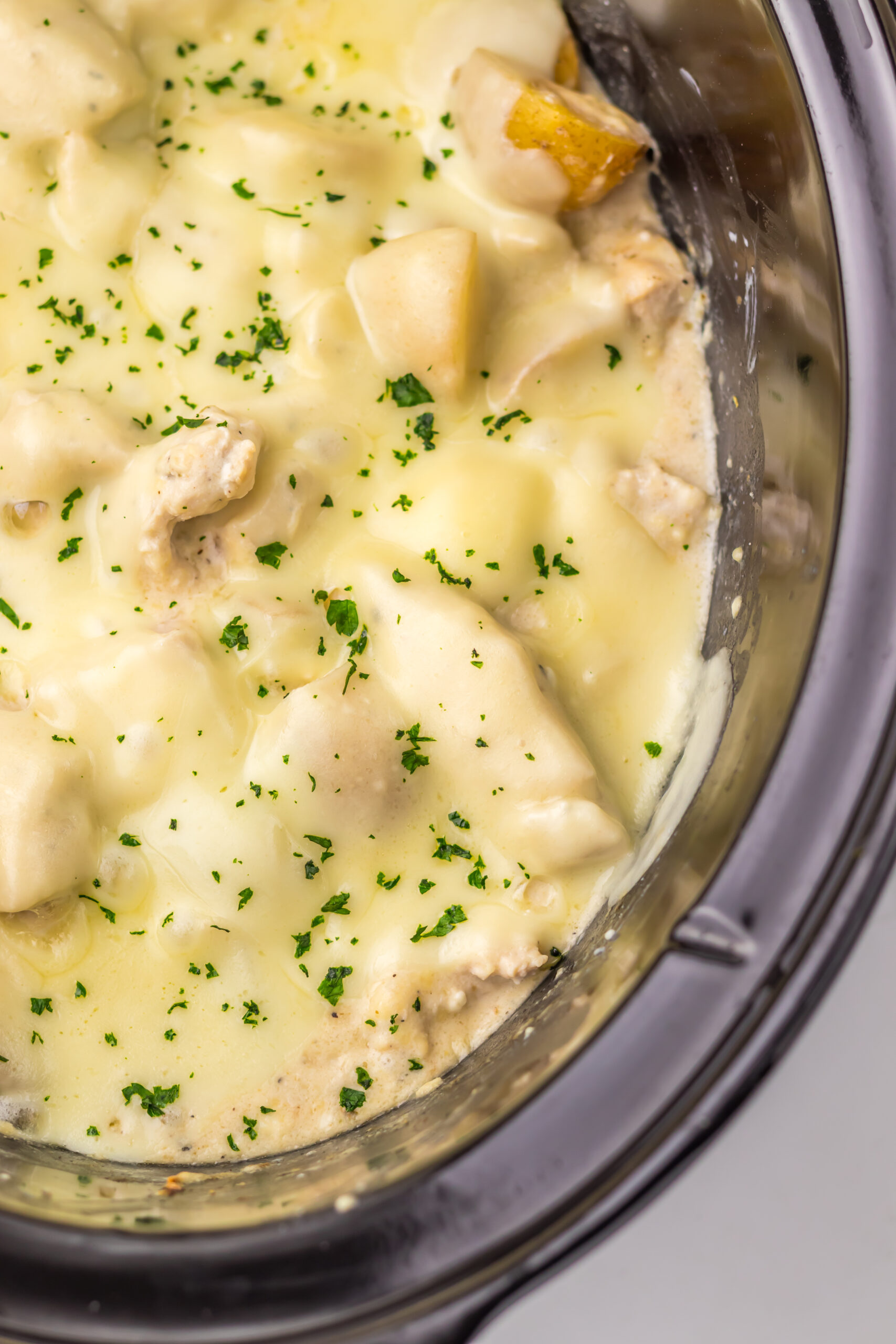 Lay the provolone on top and cover until melty, then finish with chopped parsley and a little extra Parmesan.