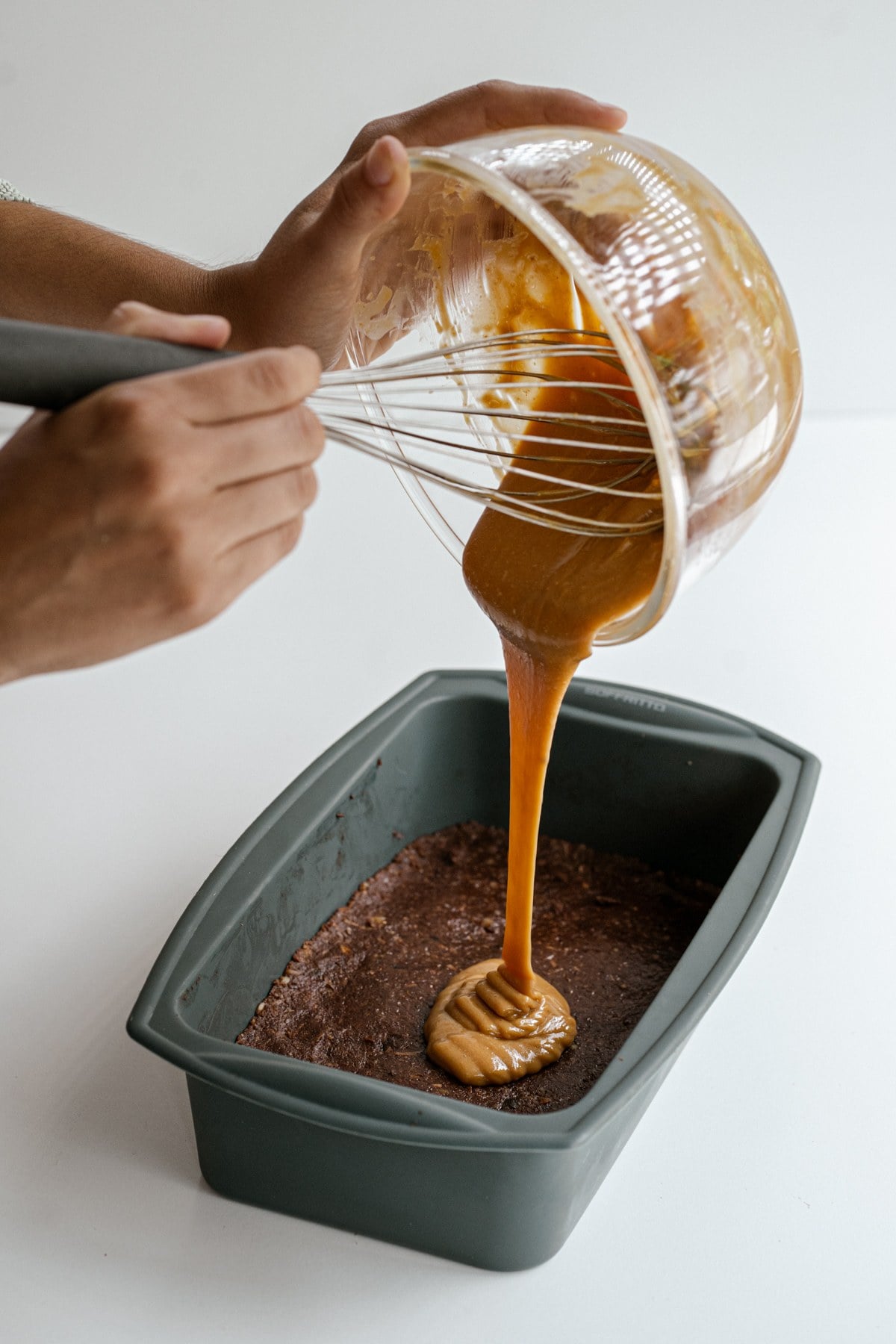 Peanut butter caramel poured over the brownie base.